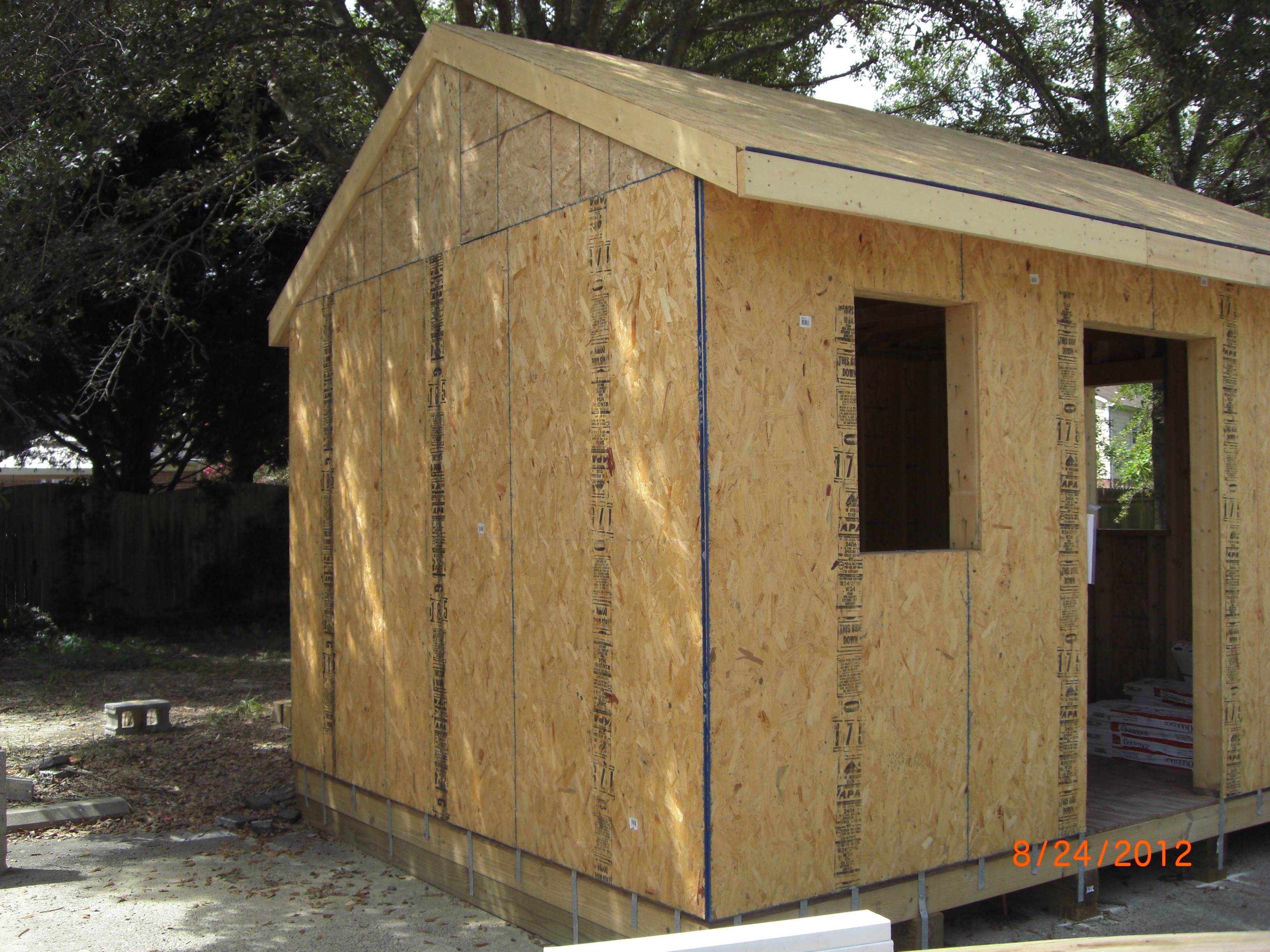 16â€³ oriented strand board (OSB) and is used for the walls and roof